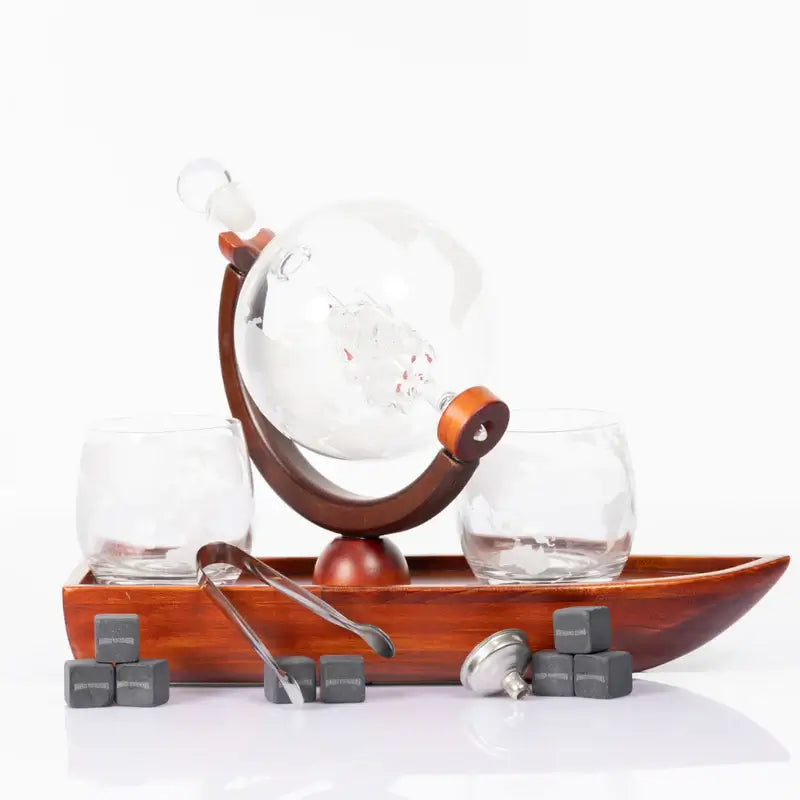 Don Vassie globe decanter set with 2 glasses and a boat shaped mahogany wooden base