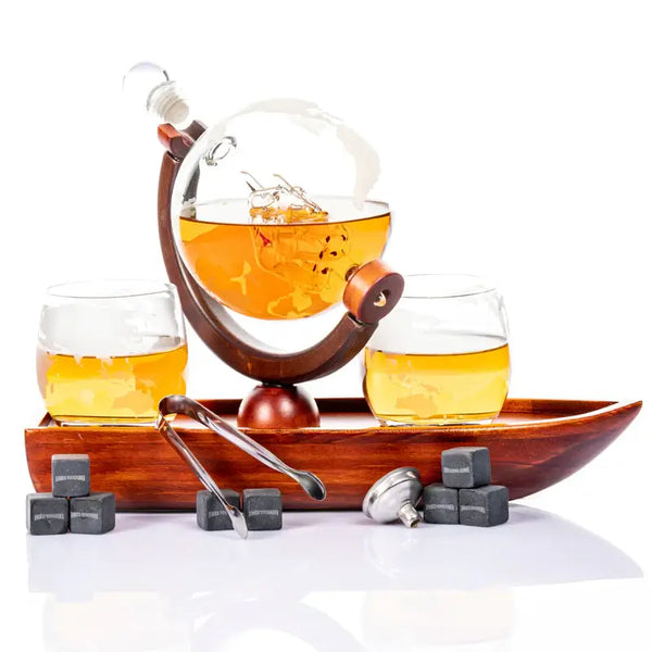 Don Vassie globe decanter set with 2 glasses and a boat shaped mahogany wooden base